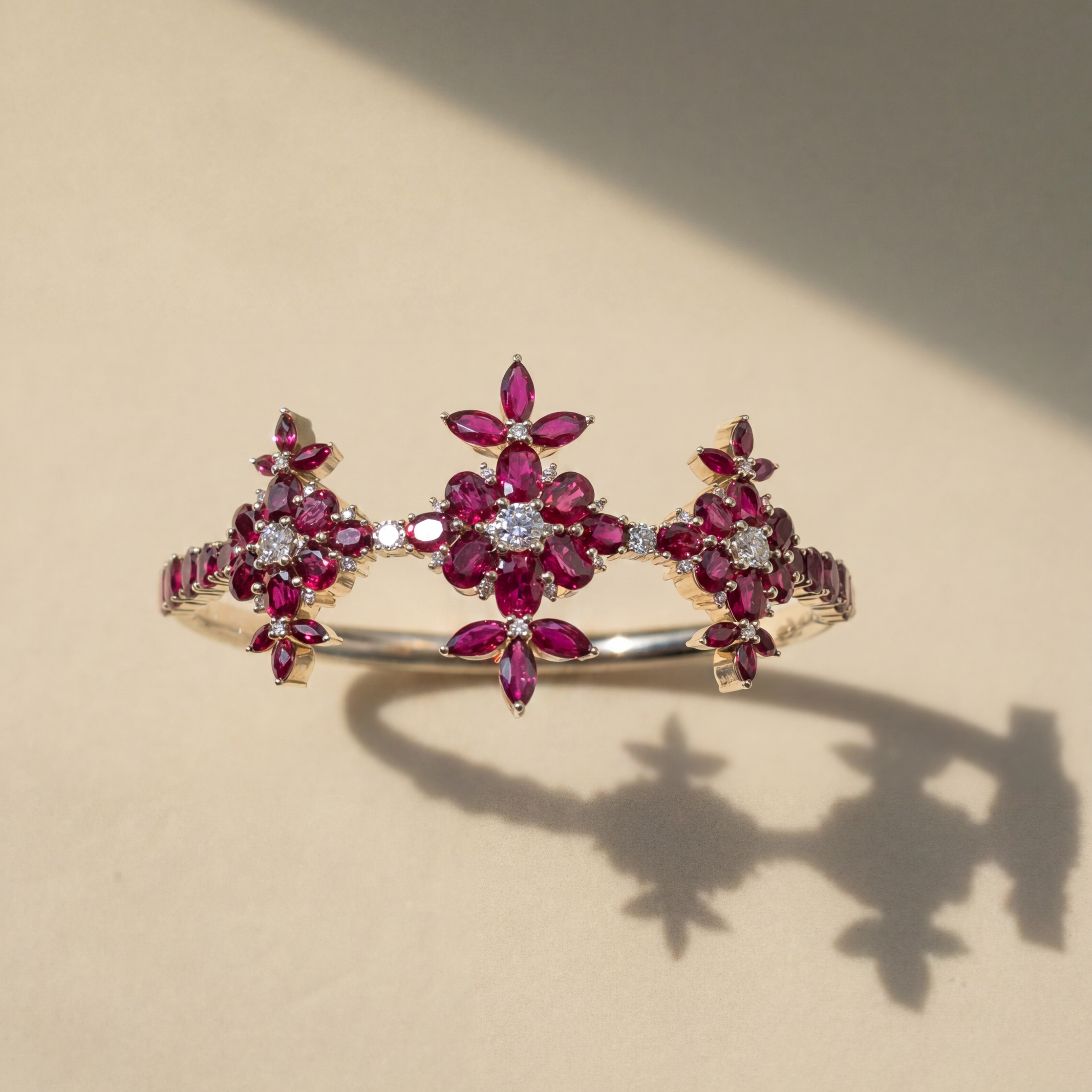 Gold bracelet with red gemstones on a beige background Lotus Mogra Inara by Sneha Sukhadia