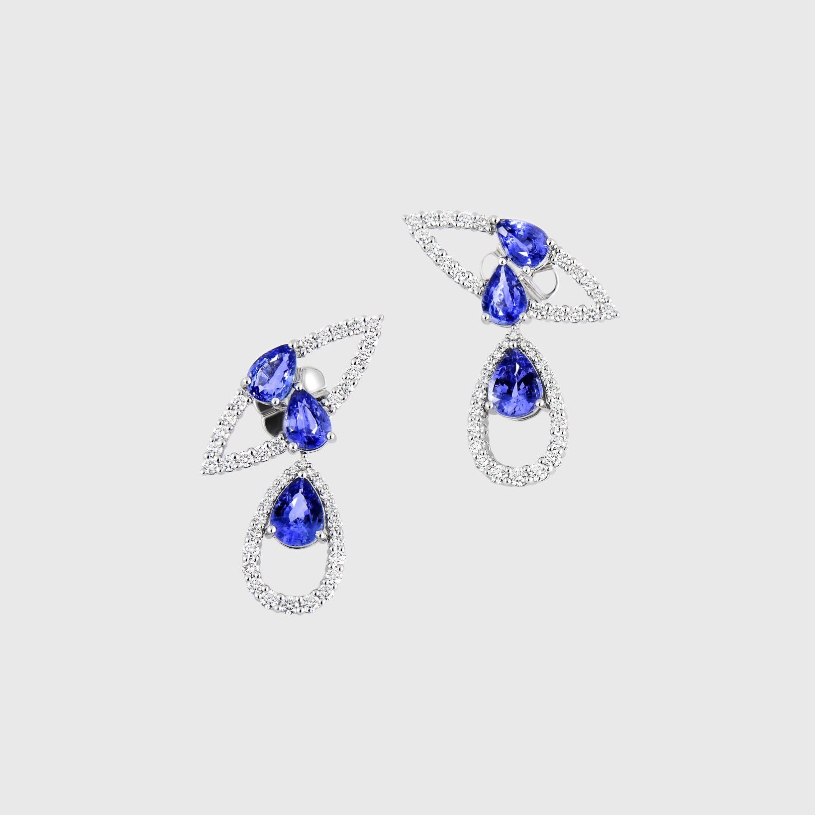 Pair of earrings with blue tear drop-shaped Sapphires with White Gold by Inara Fine Jewellery