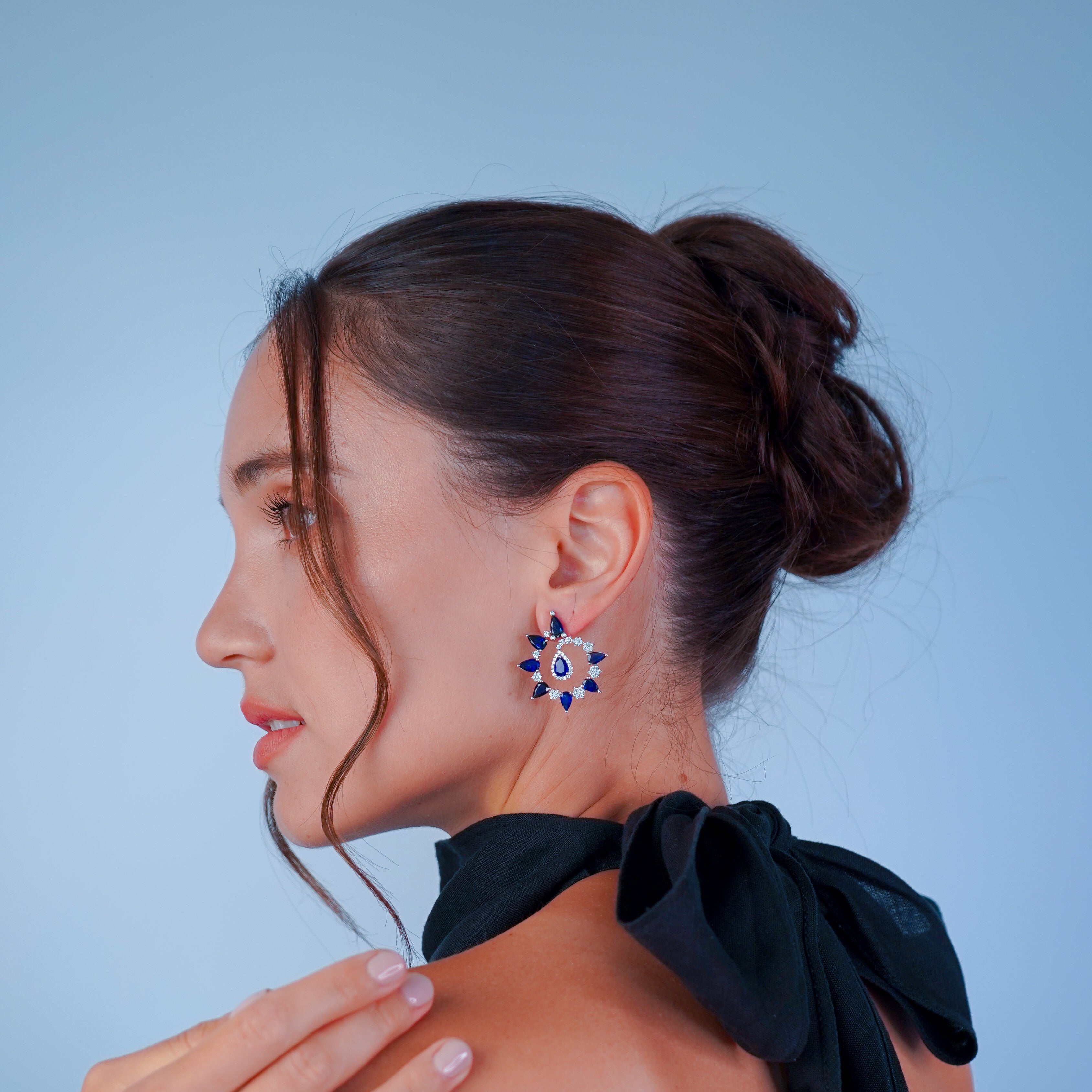 Woman wearing a black off-shoulder top with Inara Jewelry Galaxy Ring by Sneha Sukhadia 